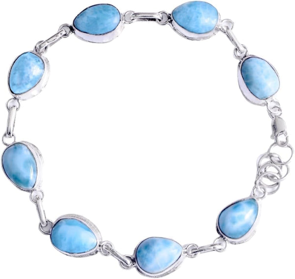 Silver bracelet with blue stone beads on a white background