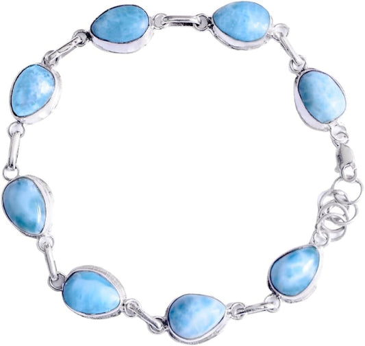 Silver bracelet with blue stone beads on a white background